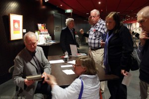 Peter Rees signing copies of his book