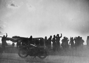 Original caption reads: "The take-off for Munich on 24 April 1944. Sunset at Waddington as one of the heavily loaded Lancasters taxies round to the take-off point; waved on their way by the usual crowd of well-wishers." Courtesy RAF Waddington Heritage Centre