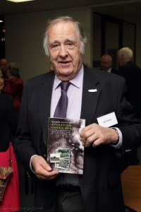 Ian Gibson with his prize, a Fighting High book donated by Capricorn Link (Australia)