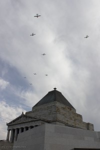 The Royal Victorian Aero Club formation passes the Shrine of Remembrance